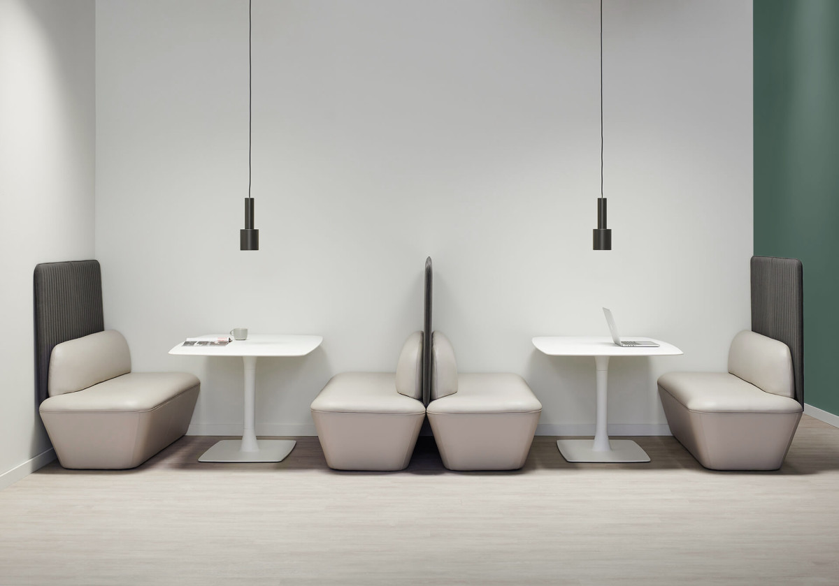 Green wall white leather seating