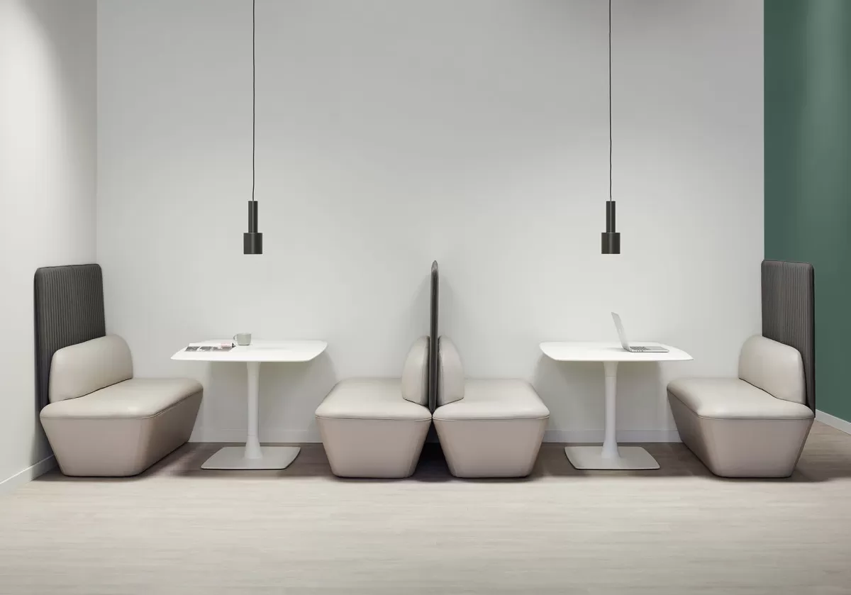 Green wall white leather seating